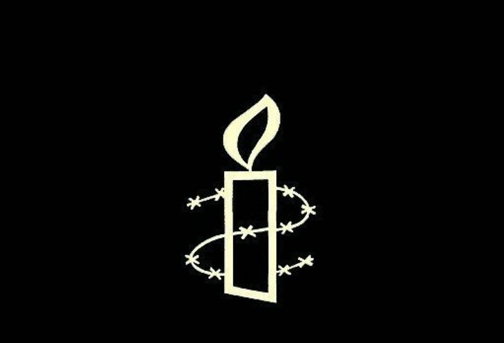 شعار لمنظمة العفو الدولية (أ ف ب)   